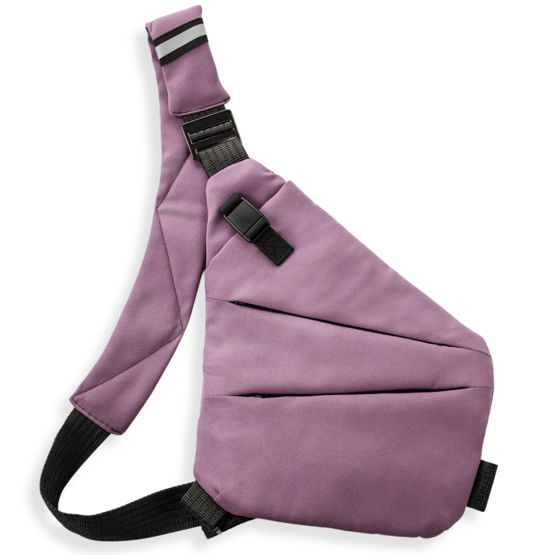 Vaultline anti-theft crossbody bag in Berry, left shoulder