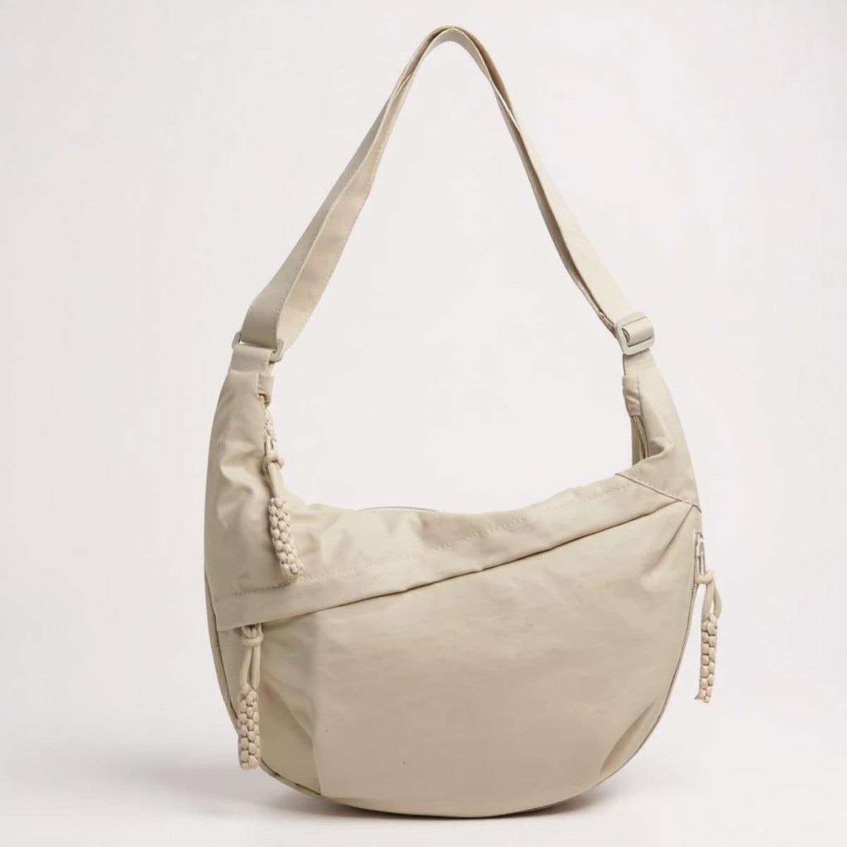 Elina crescent sling bag in Beige