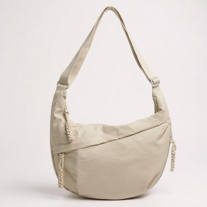 Elina crescent sling bag in Beige