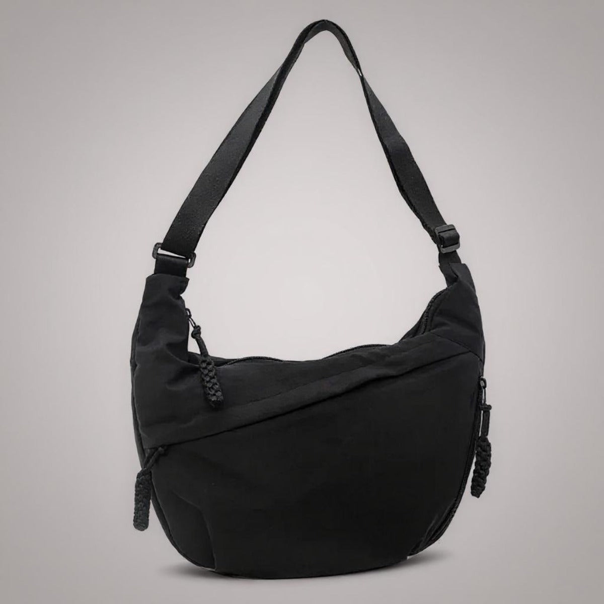 Elina crescent sling bag in Black