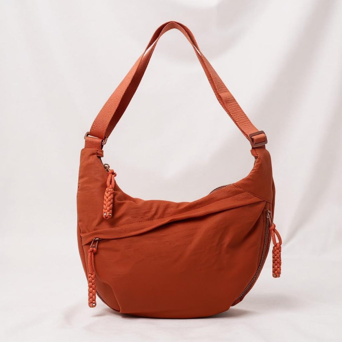 Elina crescent sling bag in Rust