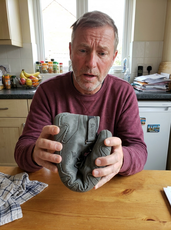 Customer photo — folding the FeetFlex sole in half at the kitchen table