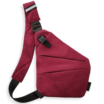 Vaultline anti-theft crossbody bag in Red, left shoulder