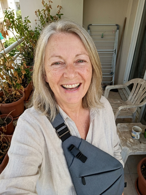 Customer photo — Vaultline bag worn on a balcony